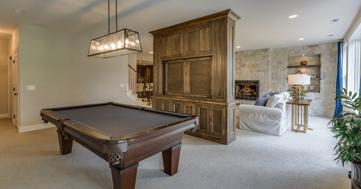 A rustic modern basement with wooden divider.