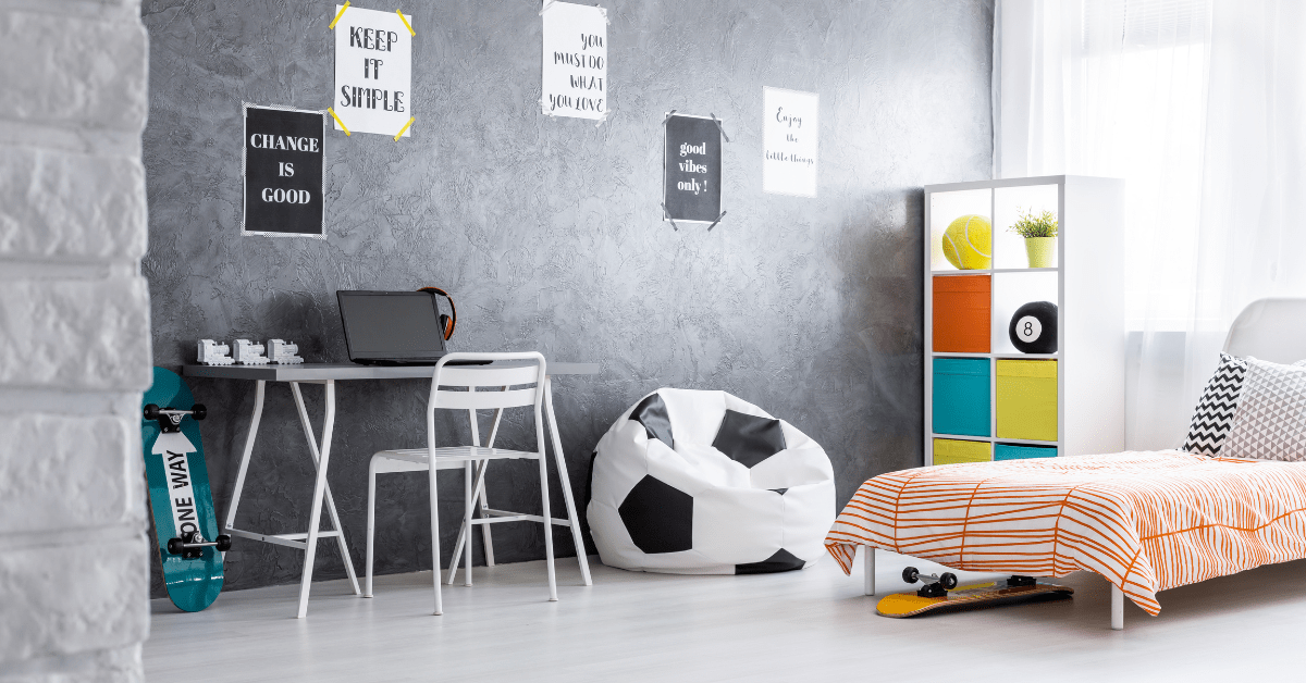 A playful small boys bedroom with desk for homework.