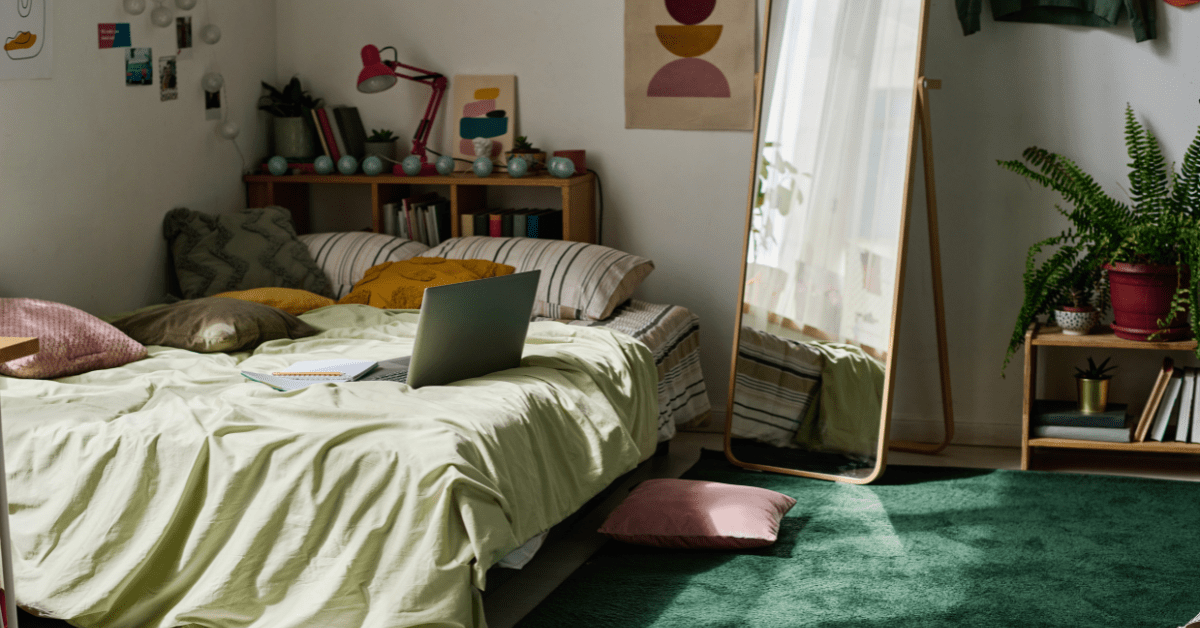 A green small boys bedroom.