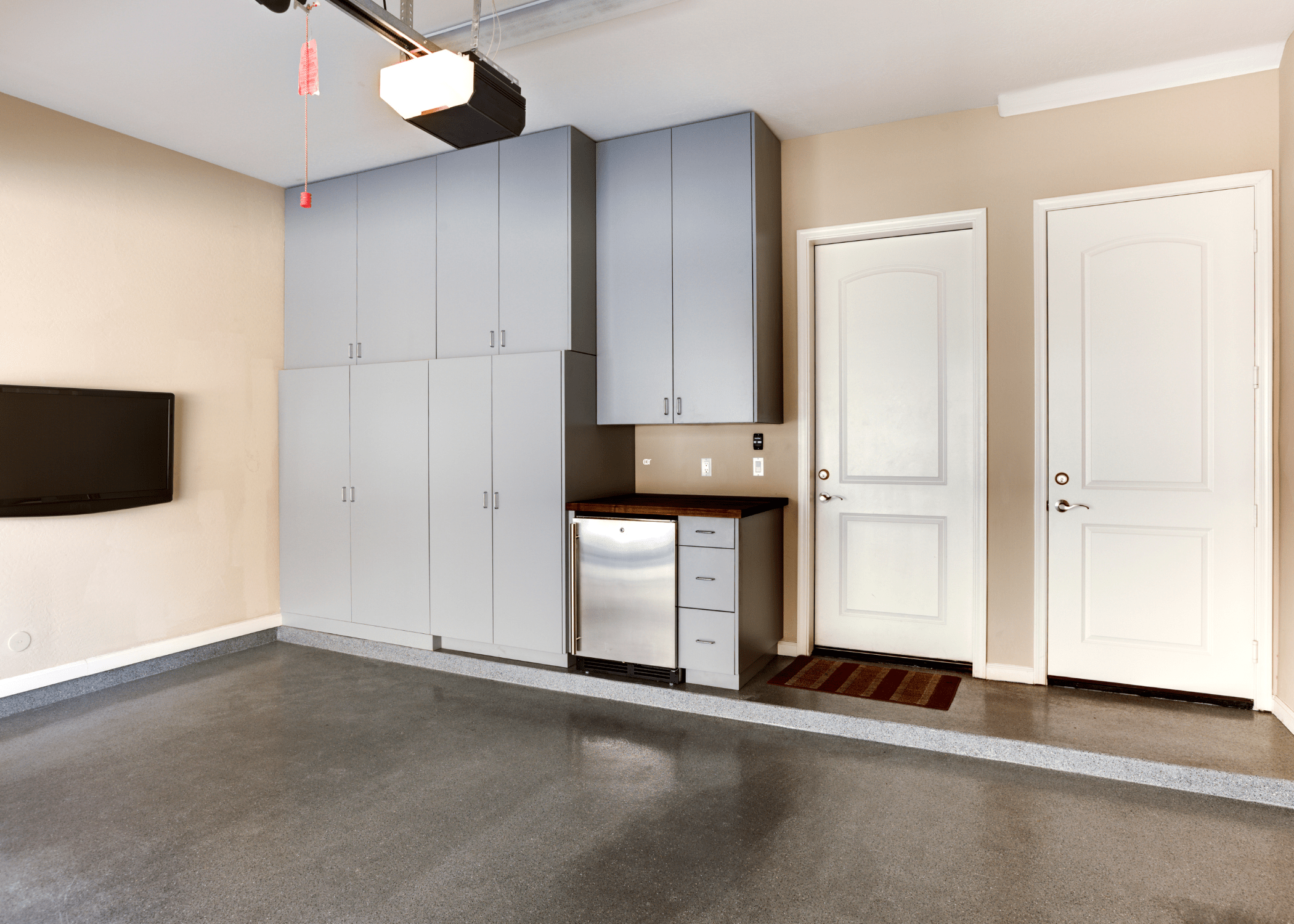 empty garage with grey cabinets.