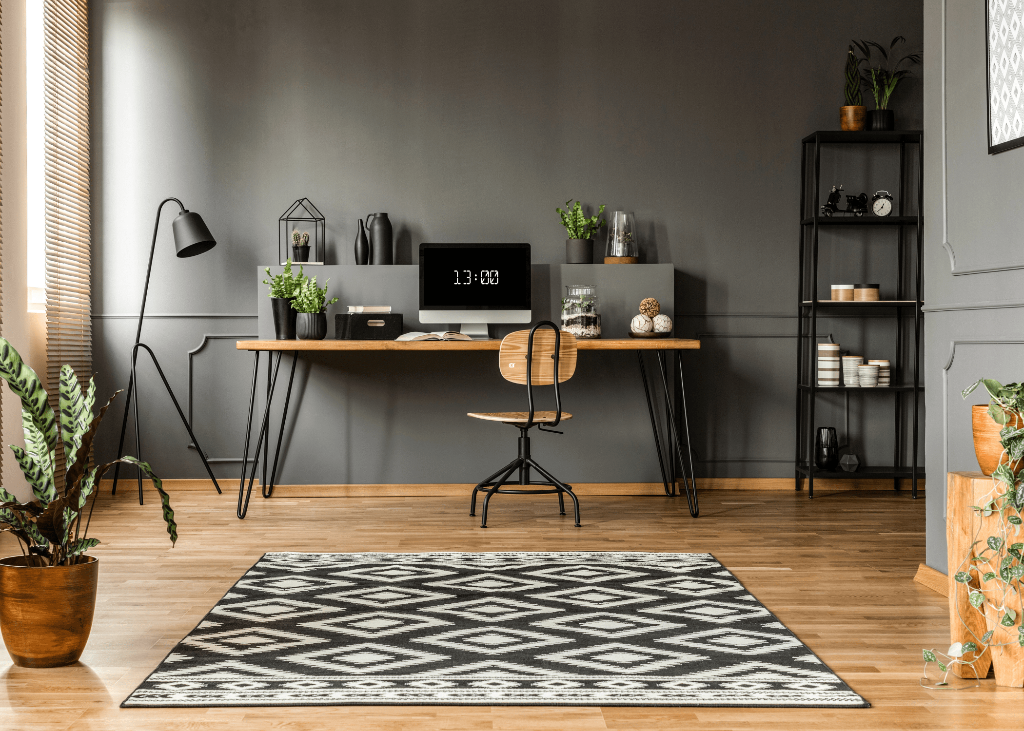 home office dark colors with wood desk and chair.