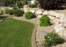 landscaped yard with rocks and grass
