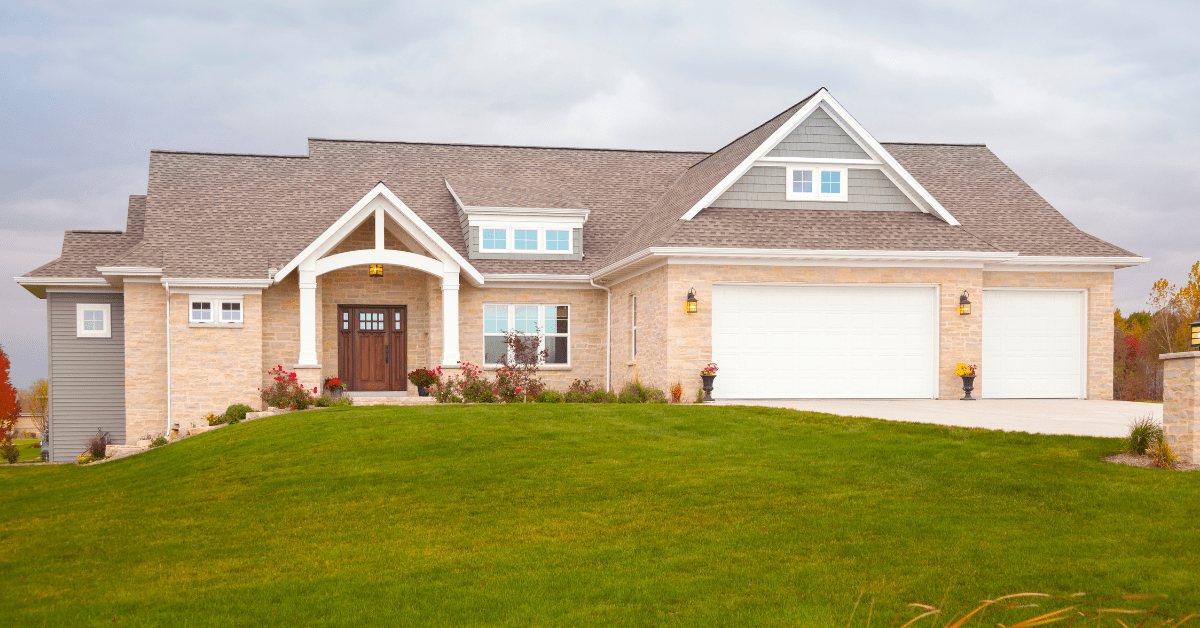 A modern ranch style house with beige exterior color.