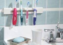 magnetic strip toothbrush holder by sink