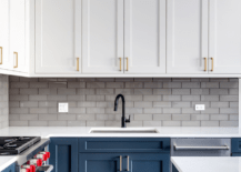 A modern blue and white kitchen.