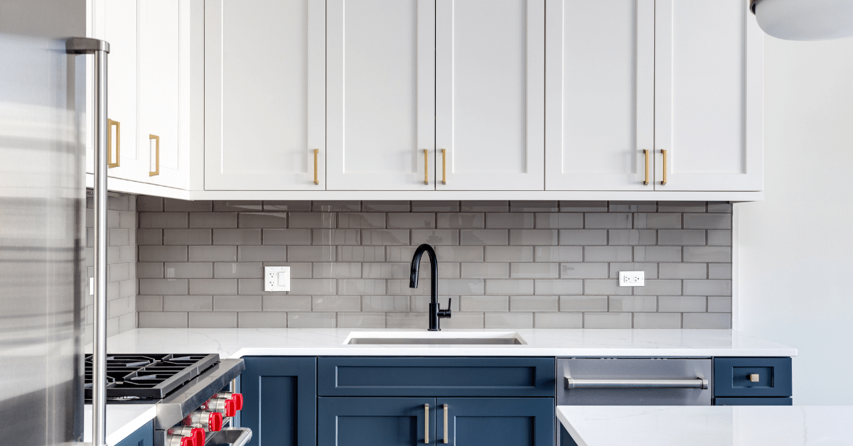 A modern blue and white kitchen.