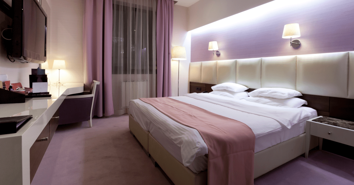 A purple and white bedroom.