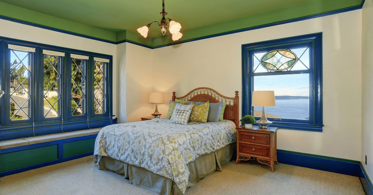 Green bedroom with blue accents.