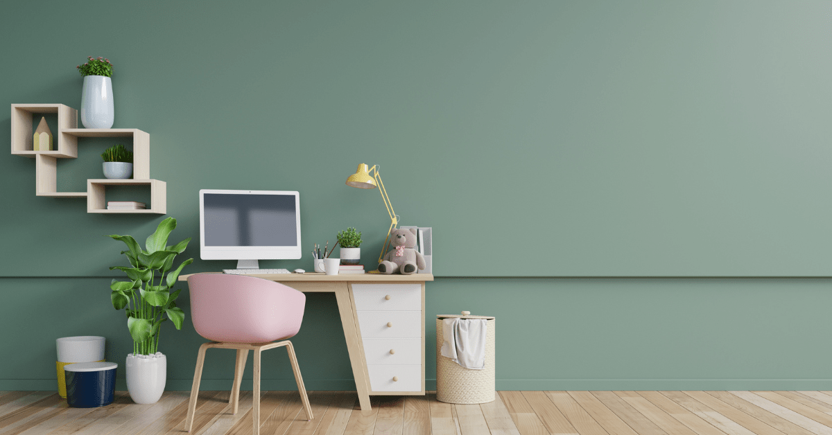 A green home office with pink accents.