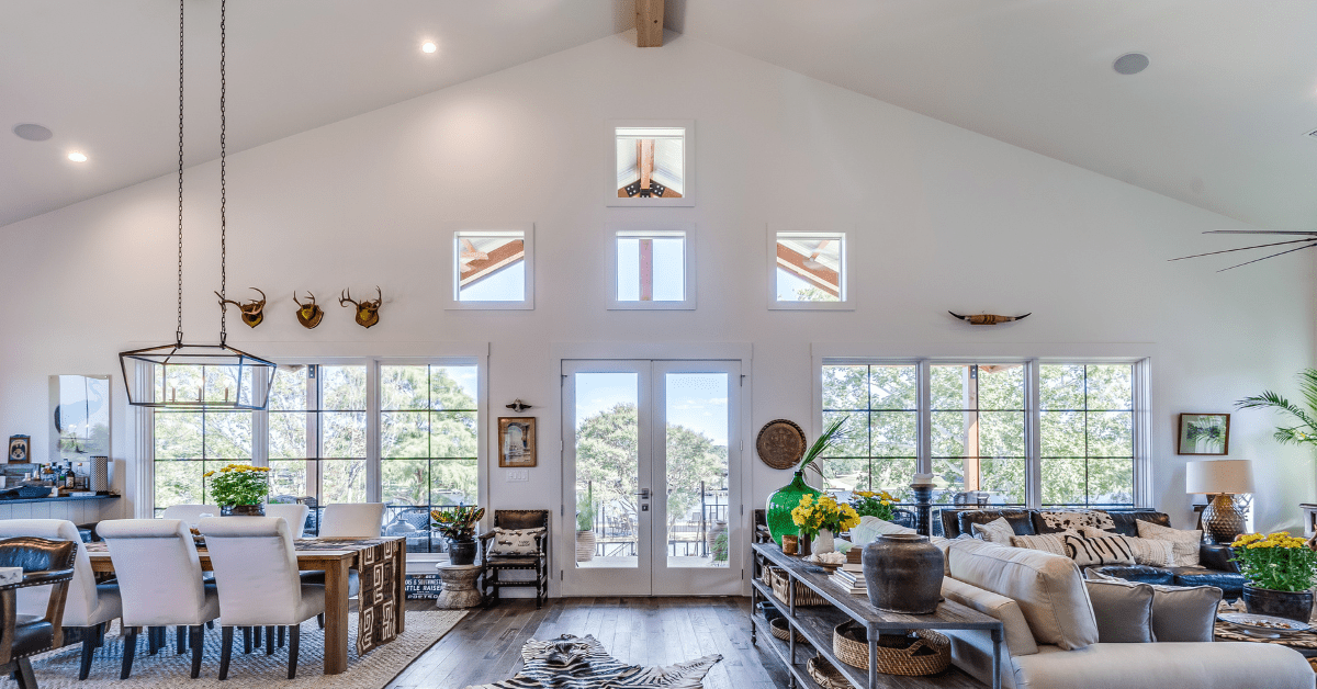 A spacious living room with vaulted ceiling and large furniture