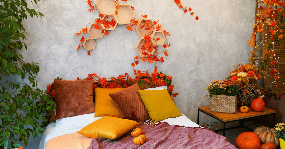 A fall-themed bed with shelves above it.