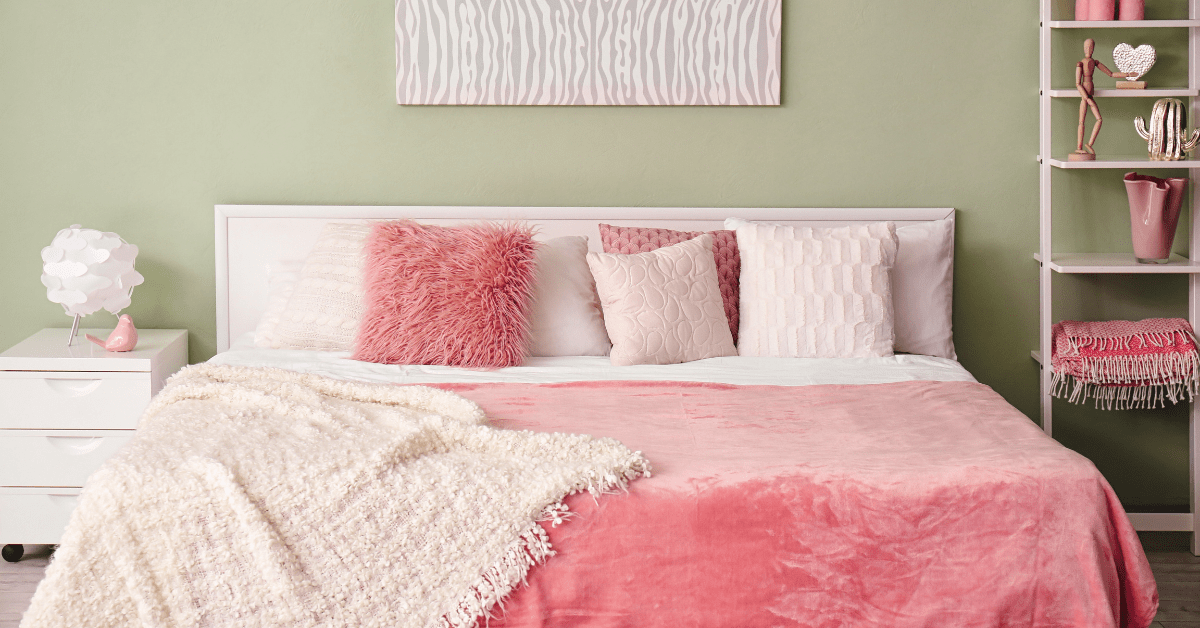 Pastel bedroom accents with green walls.