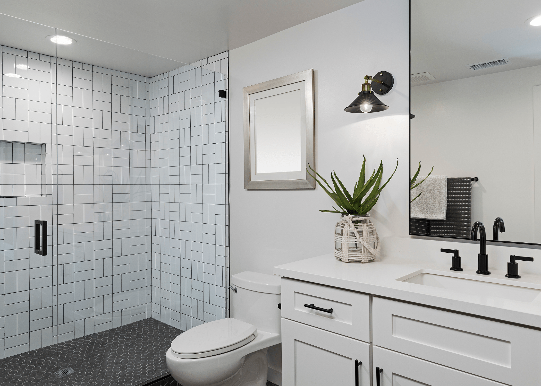 white and black 3/4 bathroom