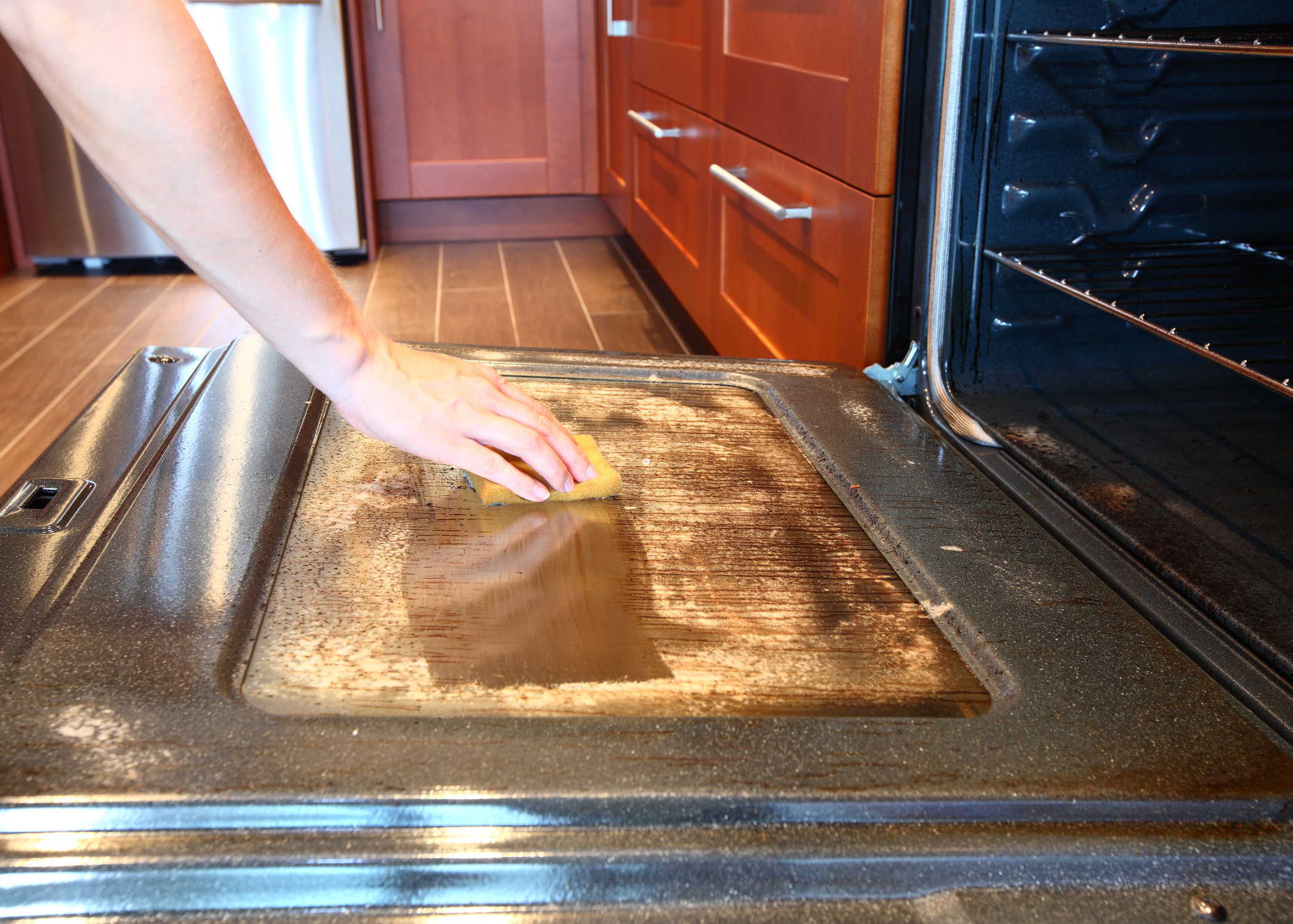 cleaning an oven door