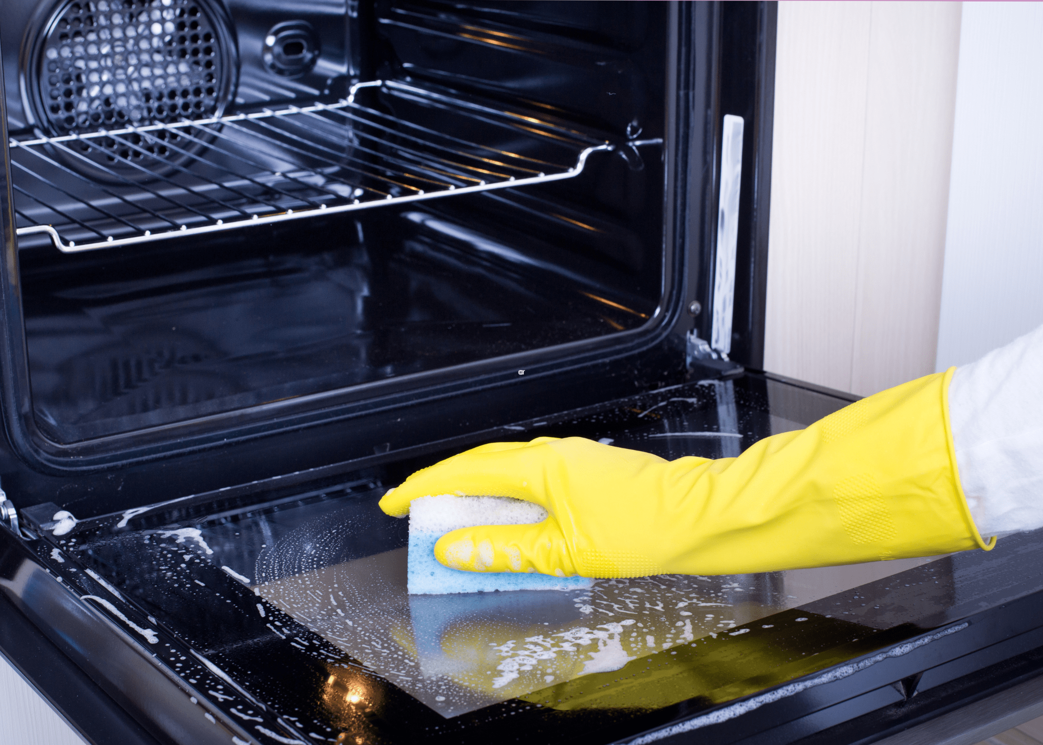 cleaning the inside of an oven with soap and water