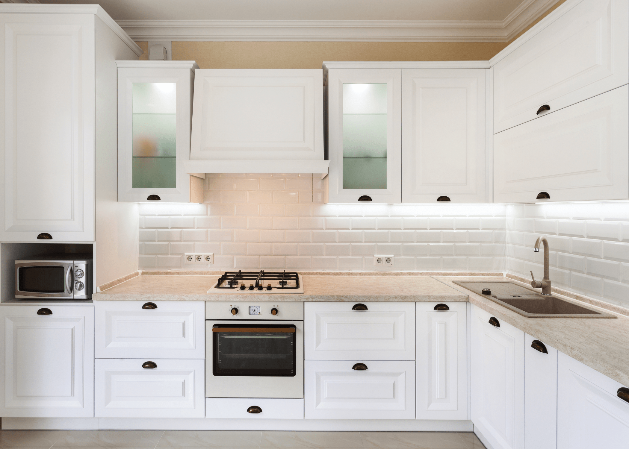 white kitchen cabinets with lights underneath