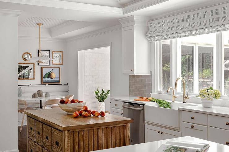 A vintage oak kitchen island is fitted with stacked drawers.