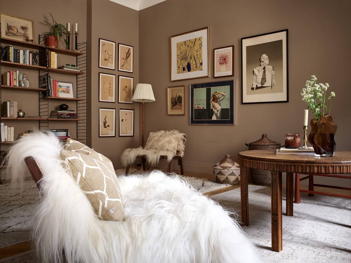 light brown walls covered in framed art