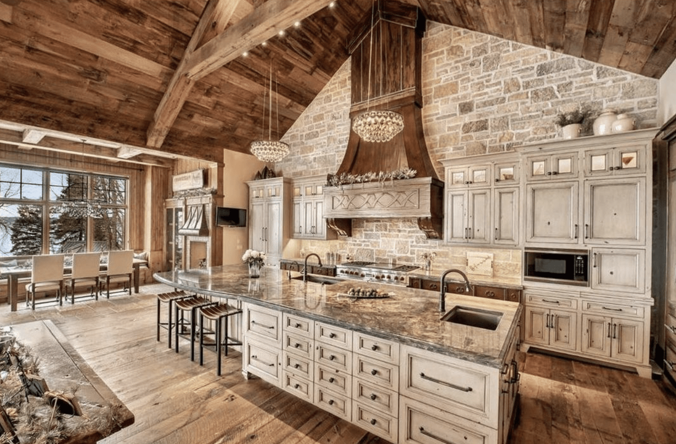 rustic kitchen inside barndominium with high vaulted ceilings