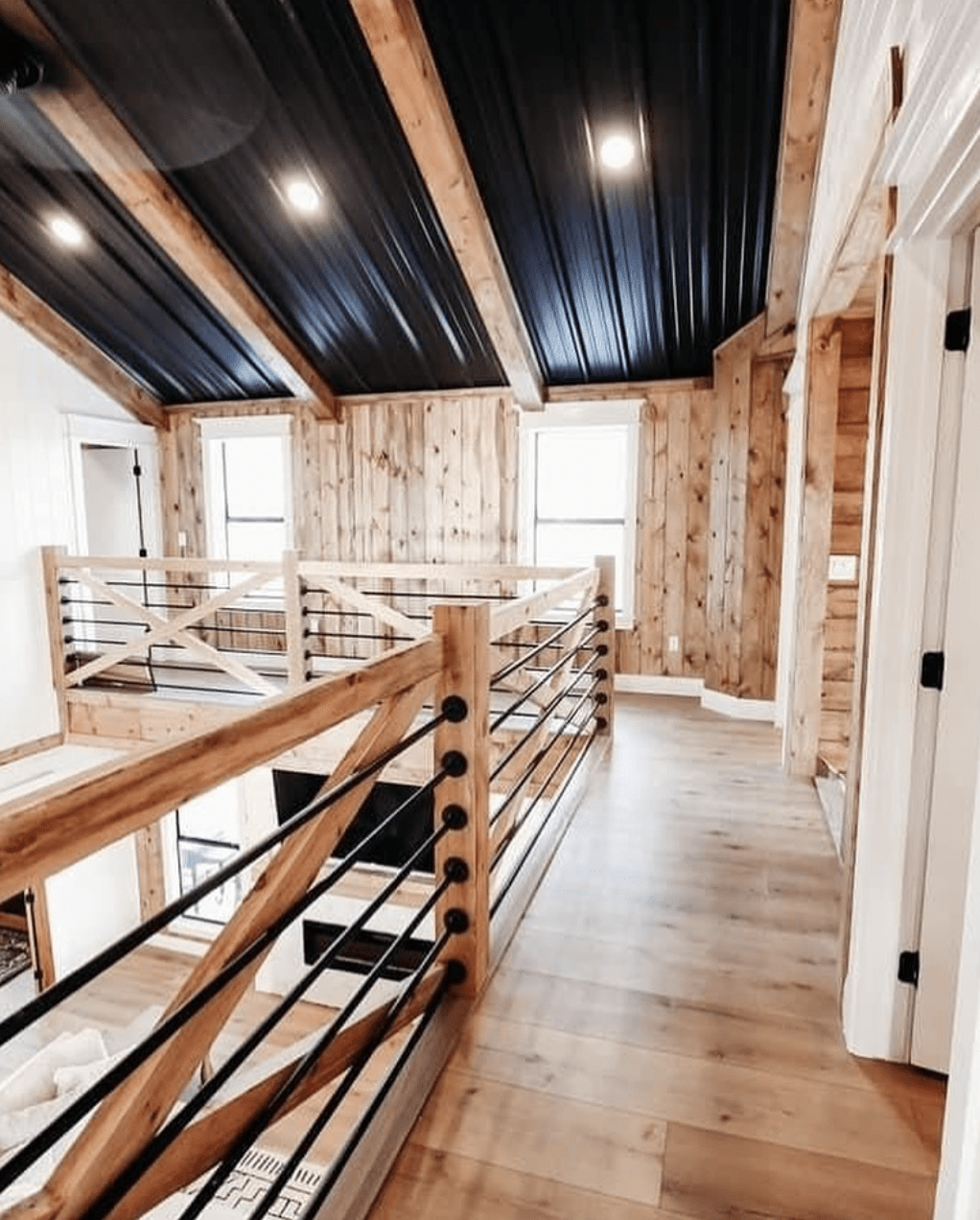 hallway in barndominium with black metal ceiling