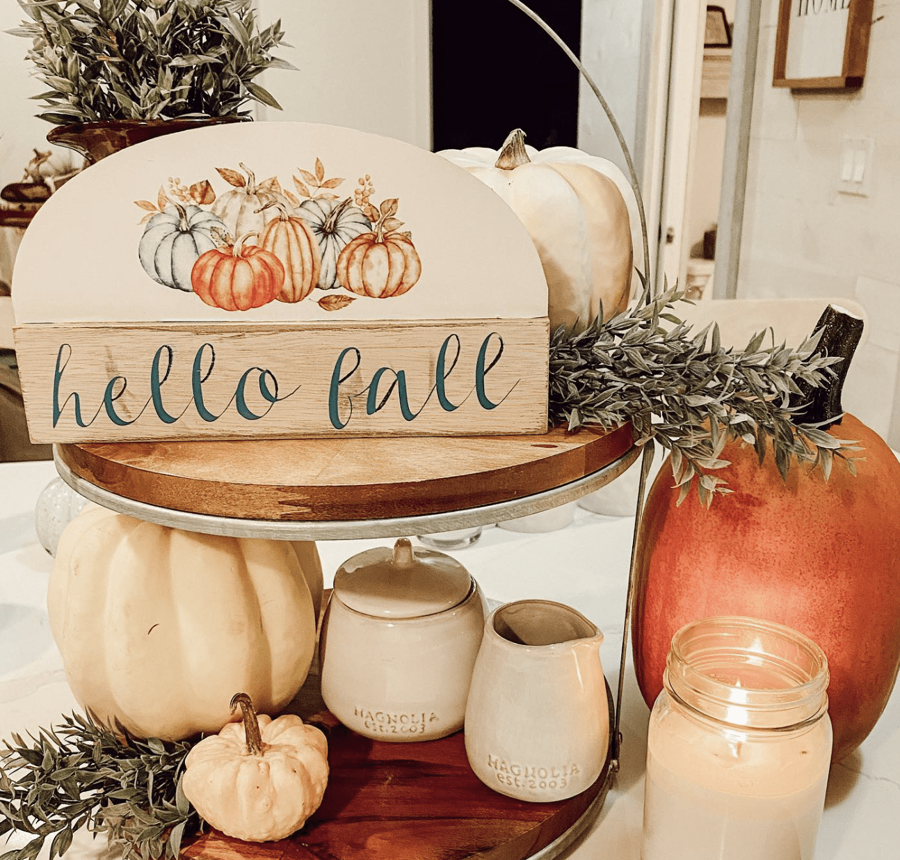 fall decorated tiered tray on kitchen counter