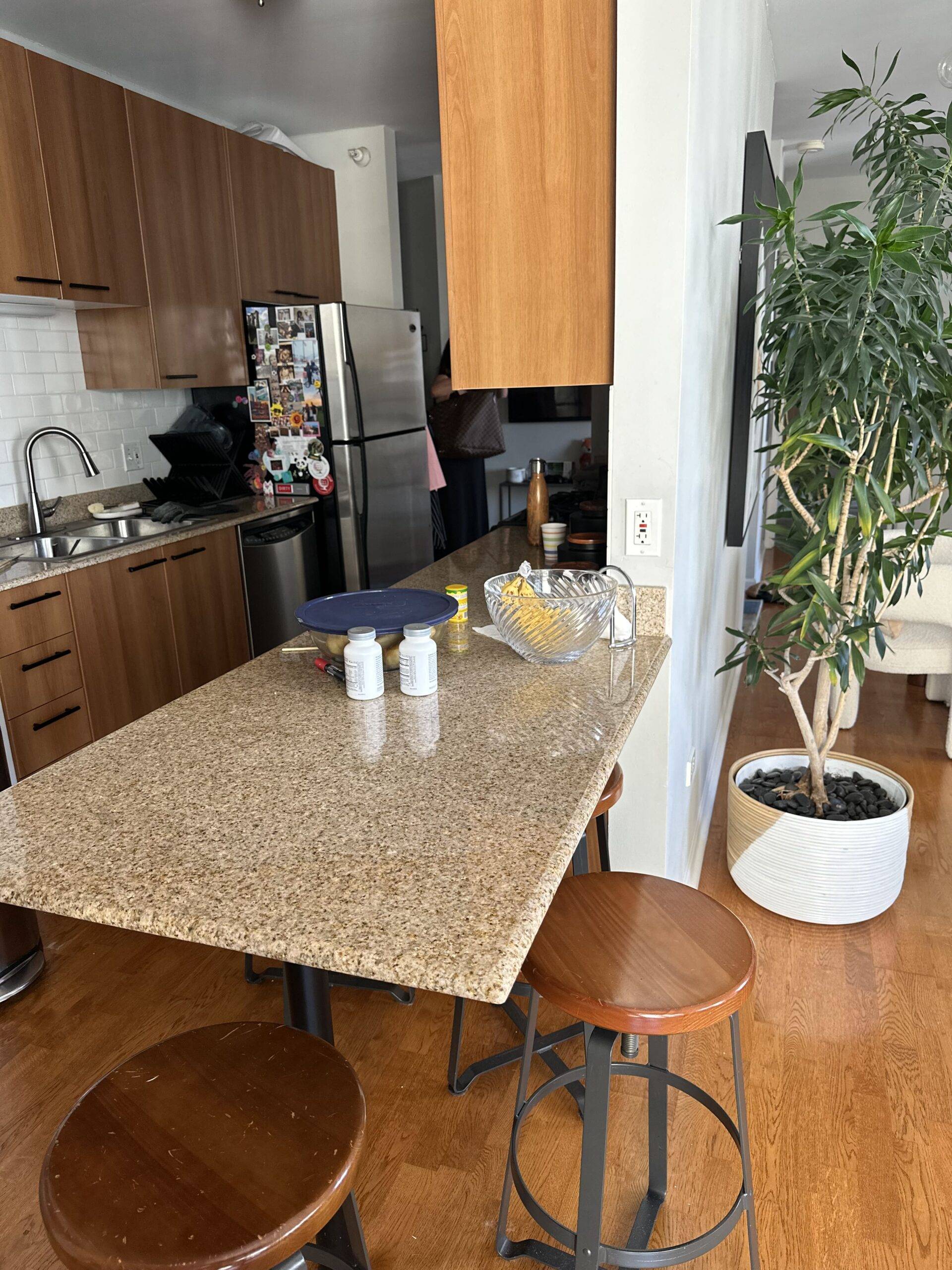 Laminate kitchen island with stools.