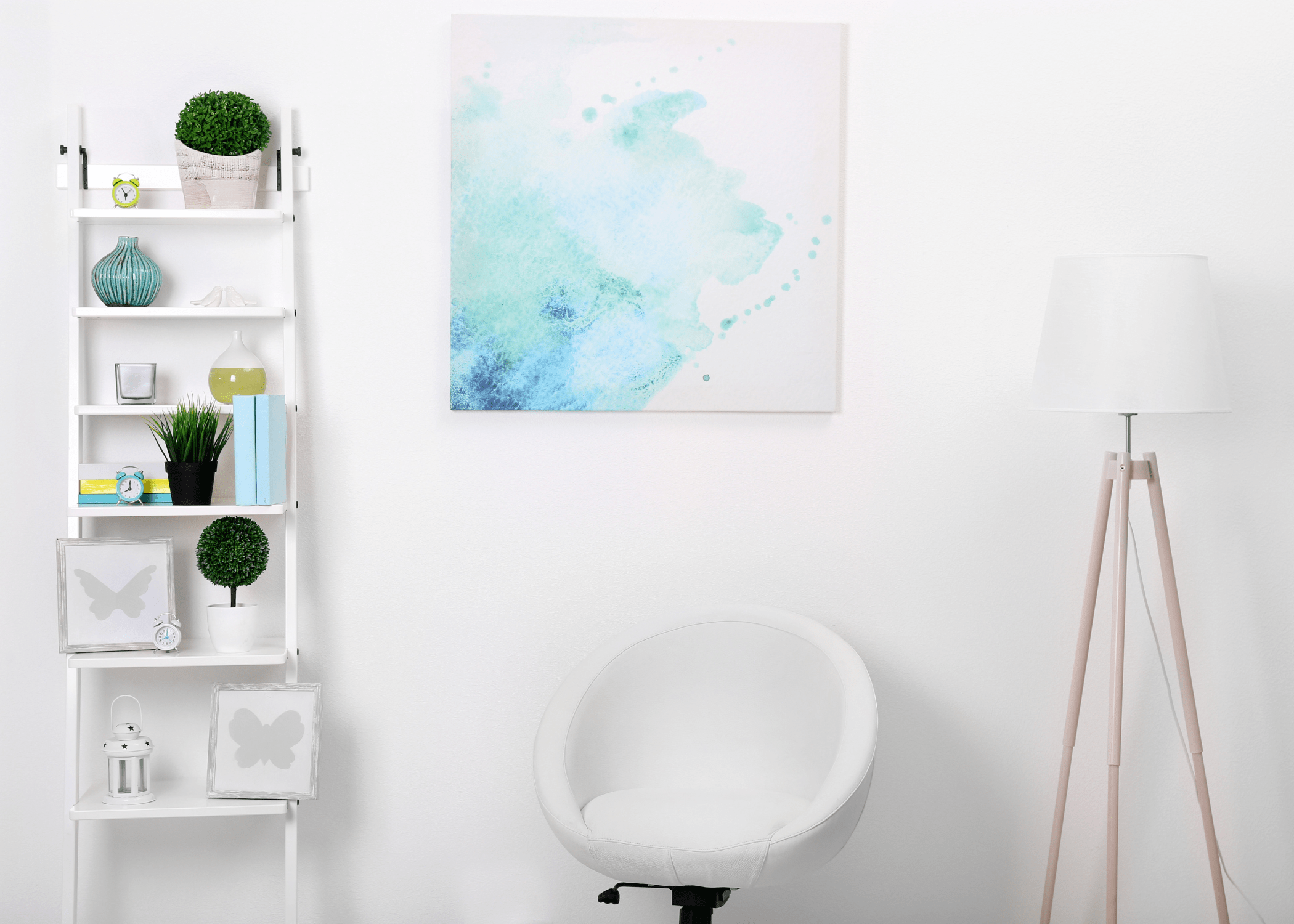 white room with large art shelf and greenery