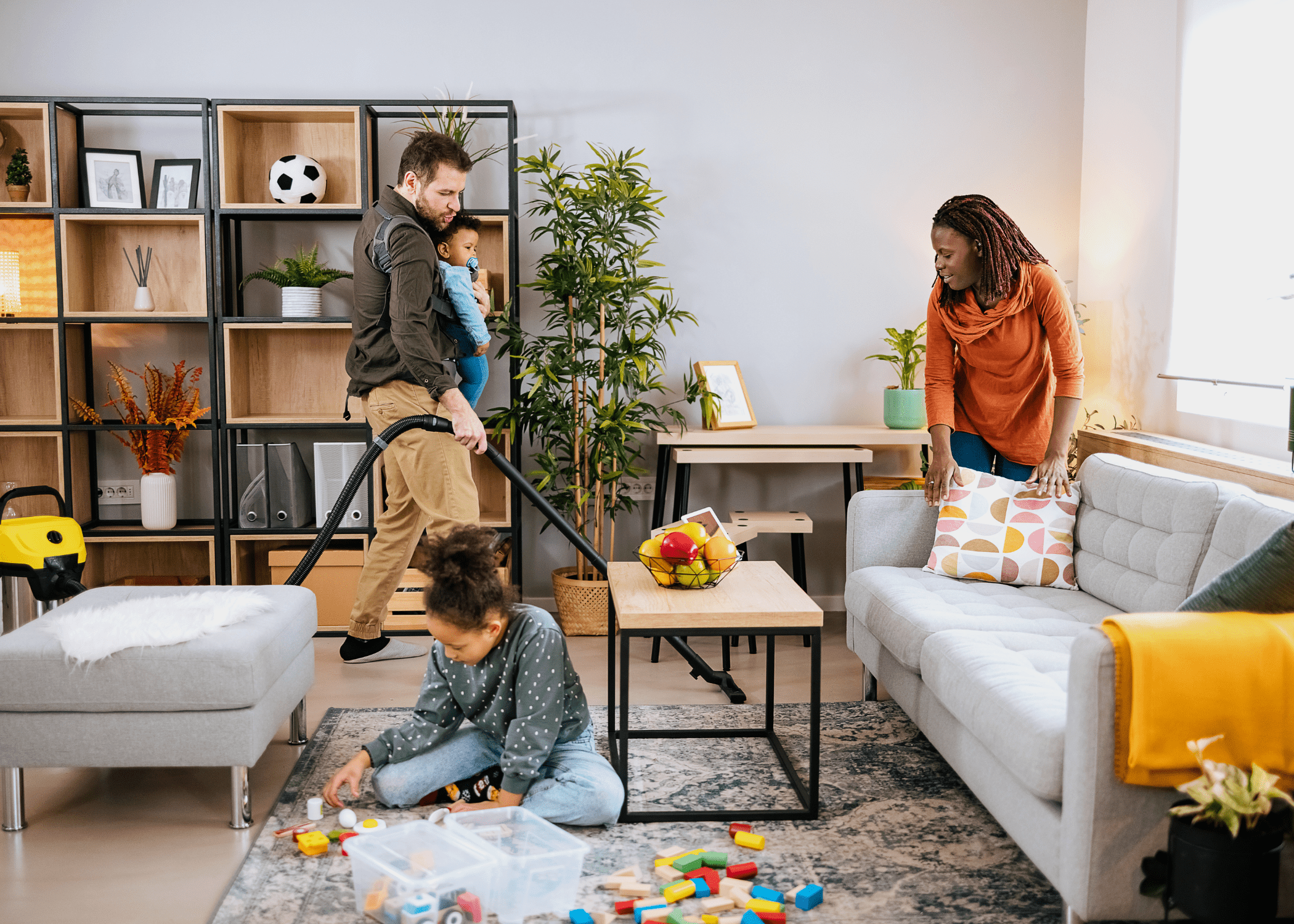 family cleaning living room