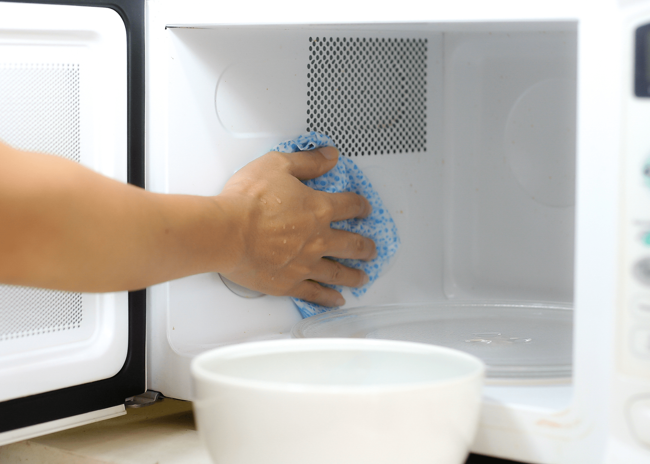 cleaning the inside of a microwave