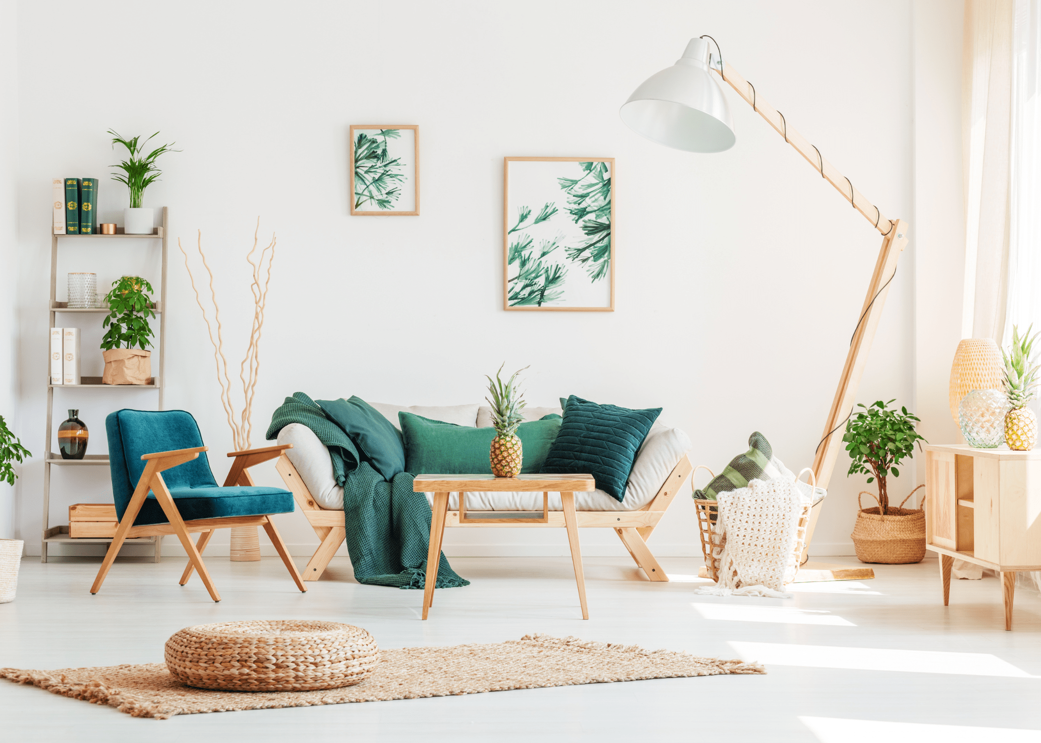 boho style living room with green accents, white walls, and white trim.