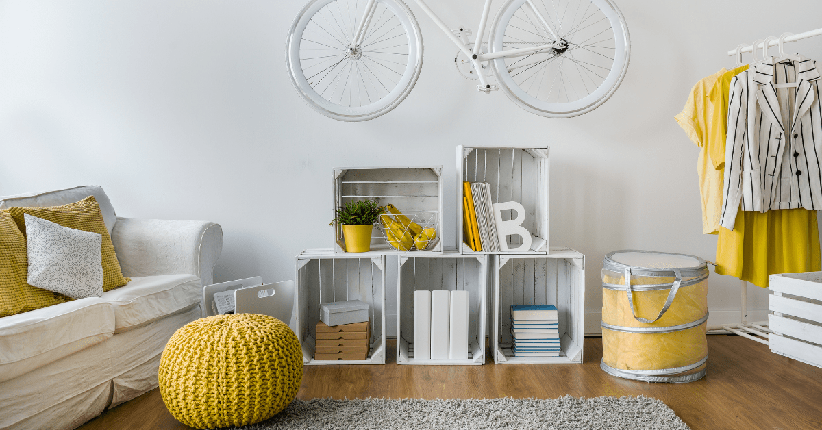 White painted bike hung in a living room.