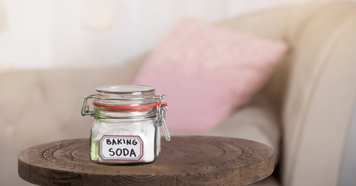 Jar of baking soda on table.