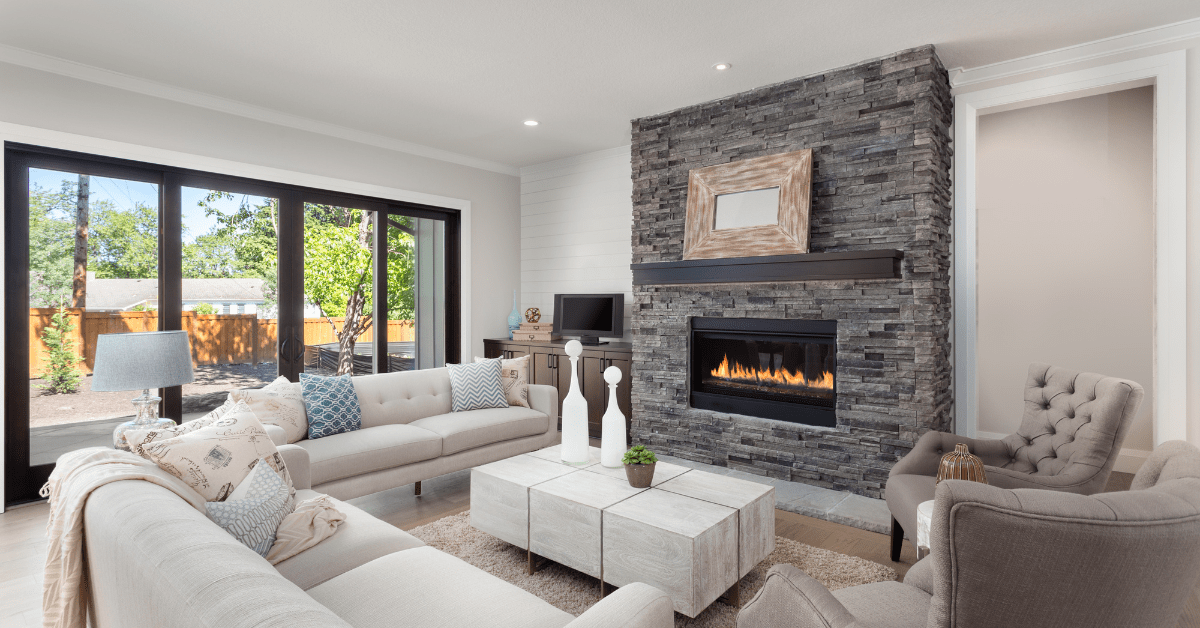 Modern floor to ceiling gray fireplace.