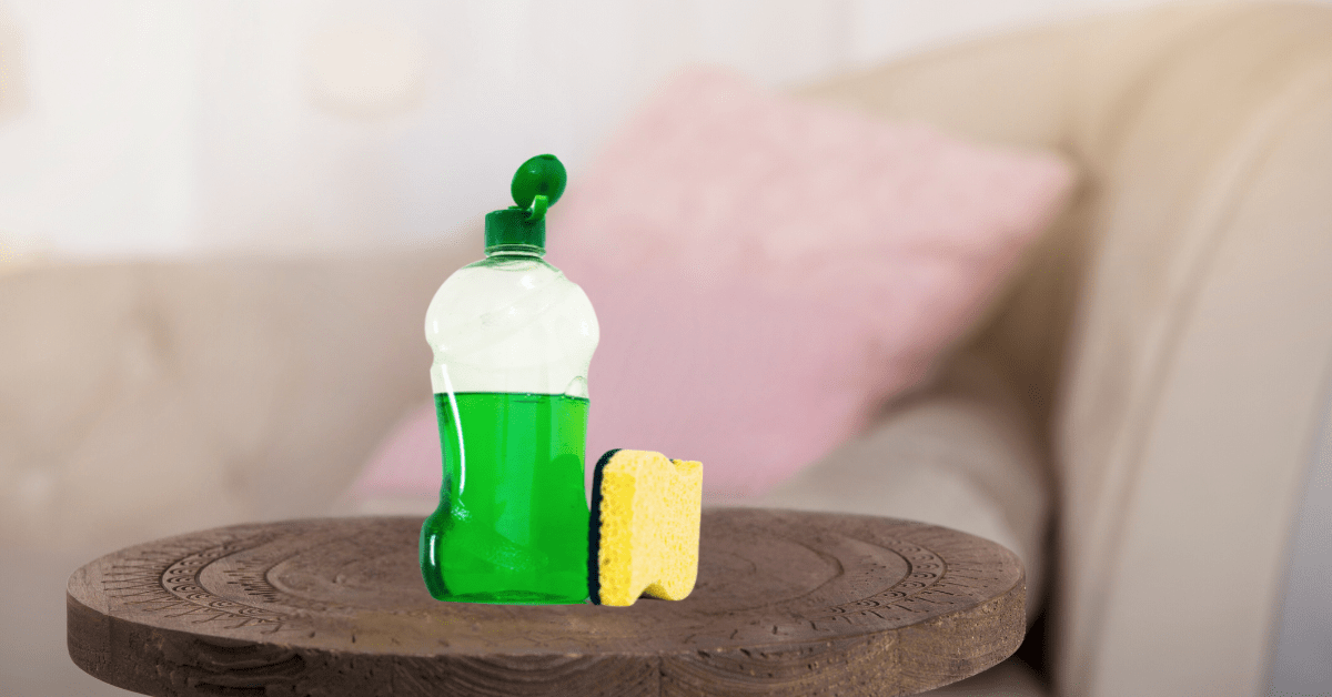 Dish soap on table in front of couch.