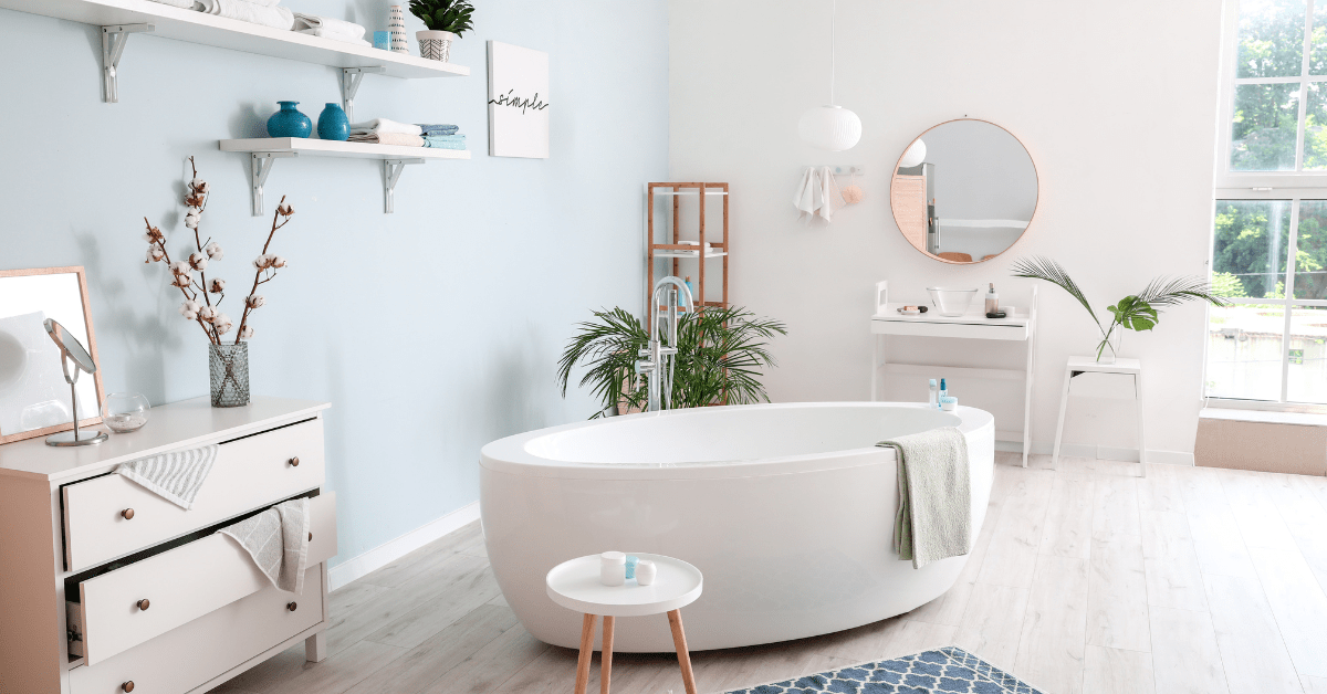 Large white bathtub in the middle of a bathroom.