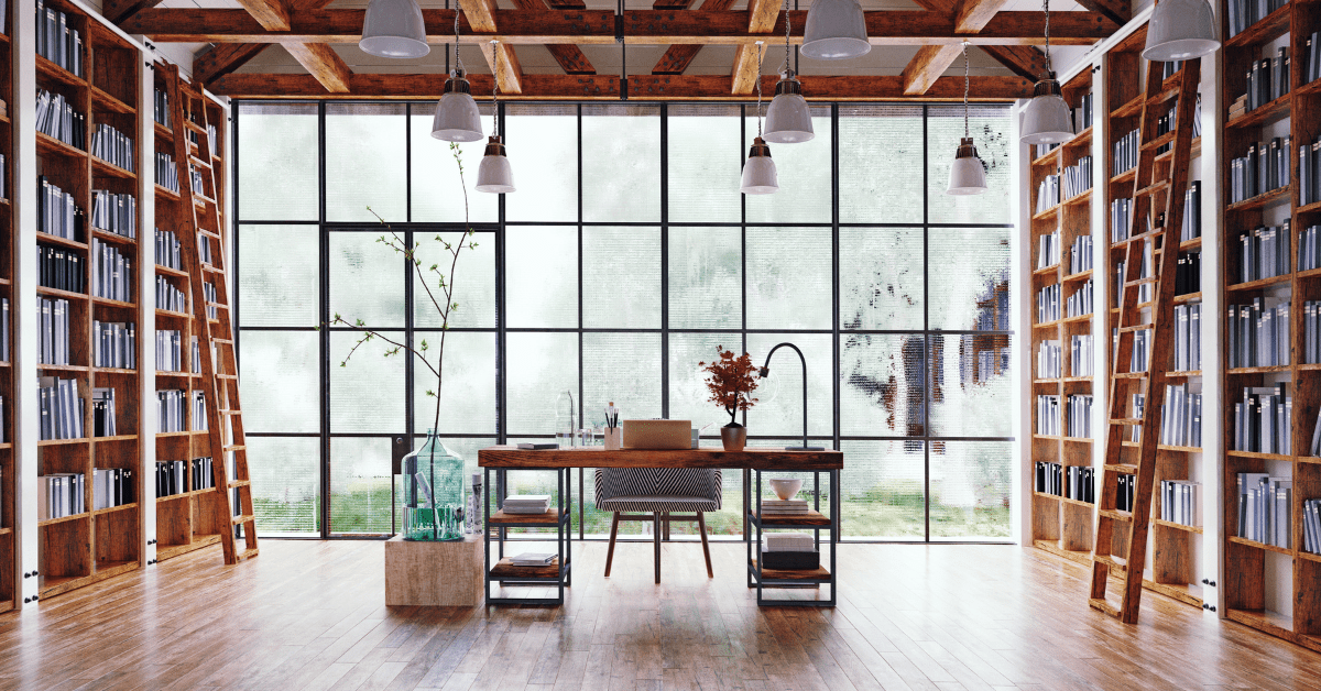 Large room with floor to ceiling bookshelves on either side.