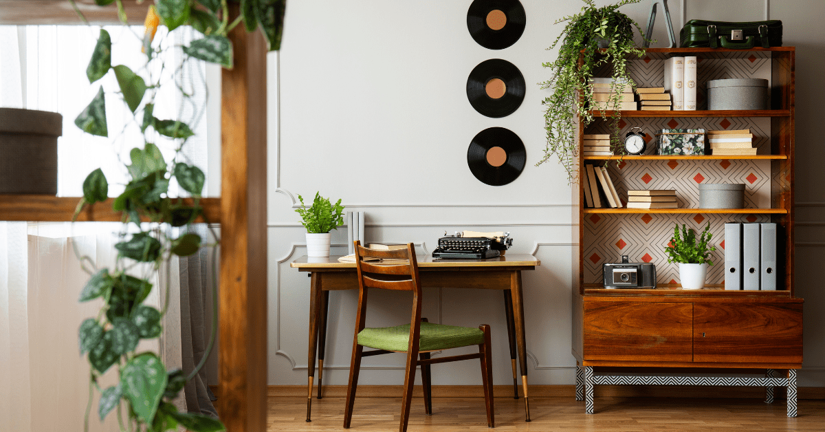 Living room with bookcase and vinyl records on the wall.