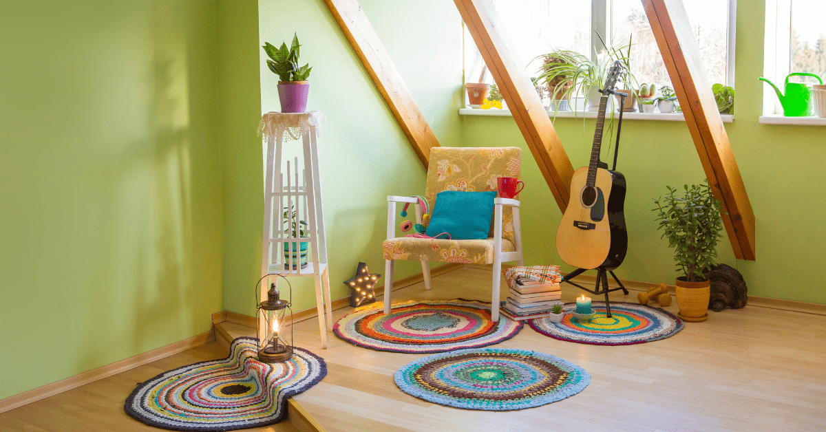 Green room with chair and multiple small rugs.