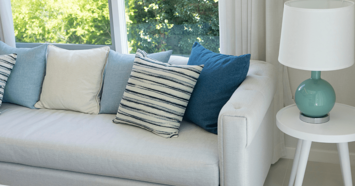 Coastal couch with throw pillows.