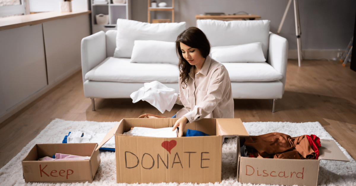 Woman sorting items to declutter.