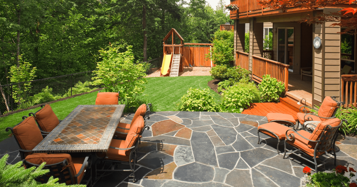 Modern backyard with orange seating.