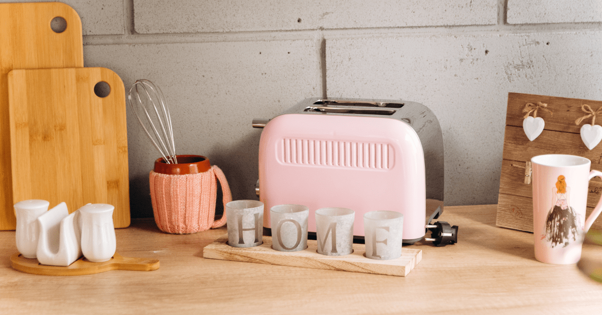 Pink toaster on a kitchen countertop.