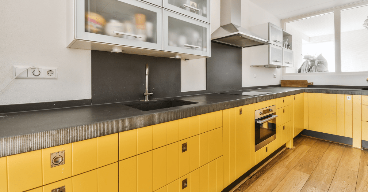 Mustard yellow kitchen cabinets.