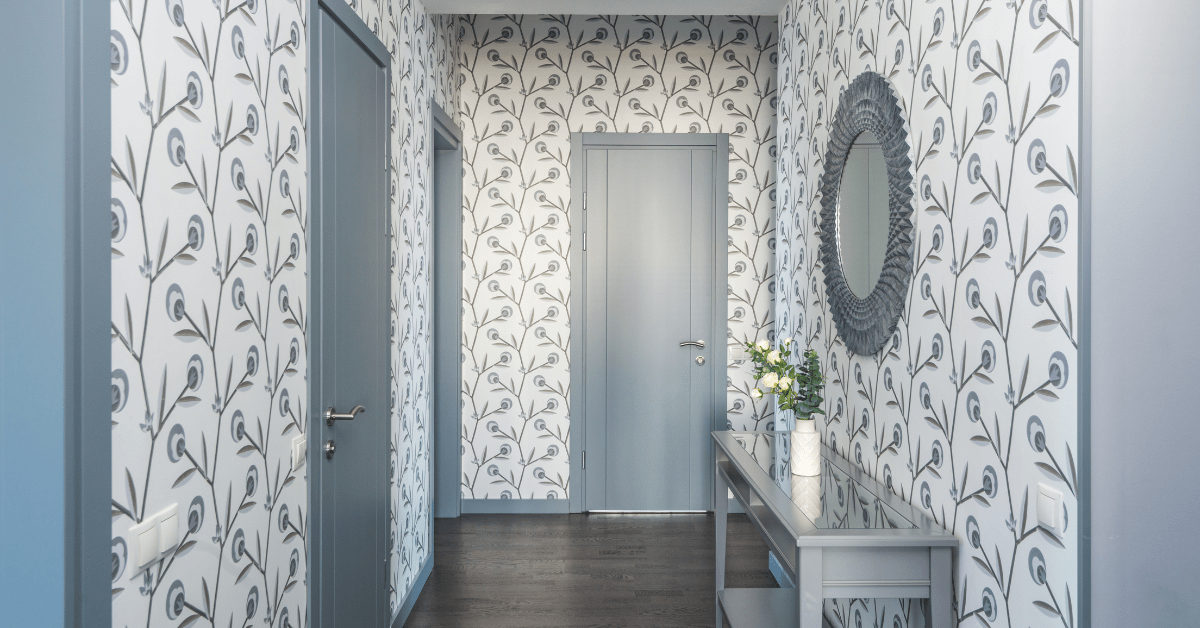 Entryway with blue and white wallpaper.