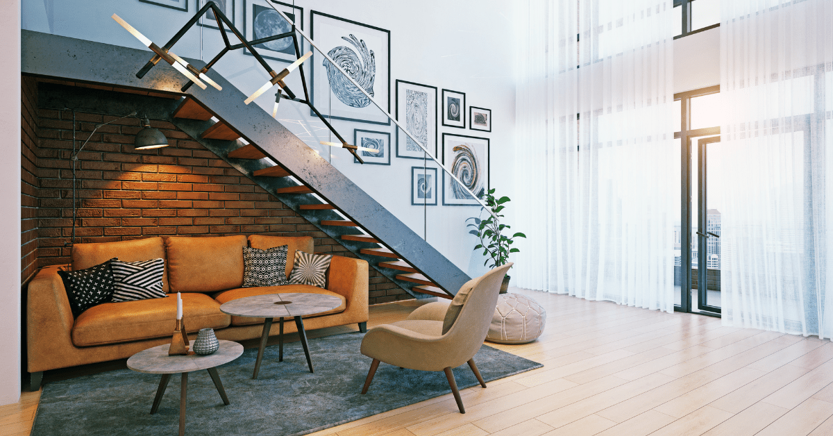 Modern staircase with art work displayed along the wall.