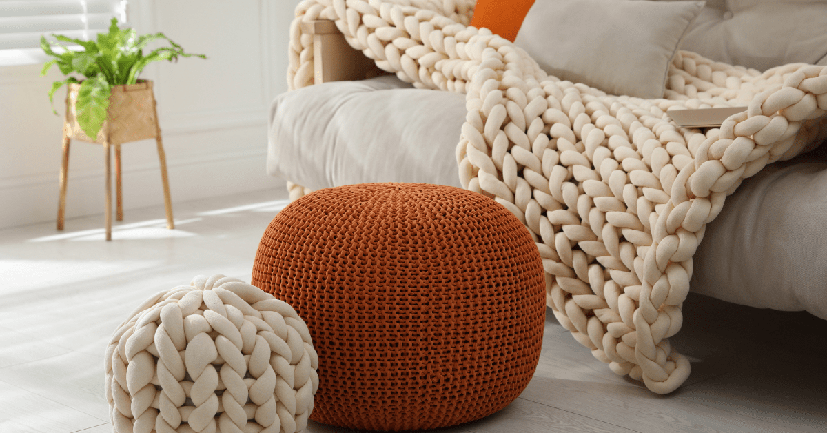 Orange decor beside a couch.