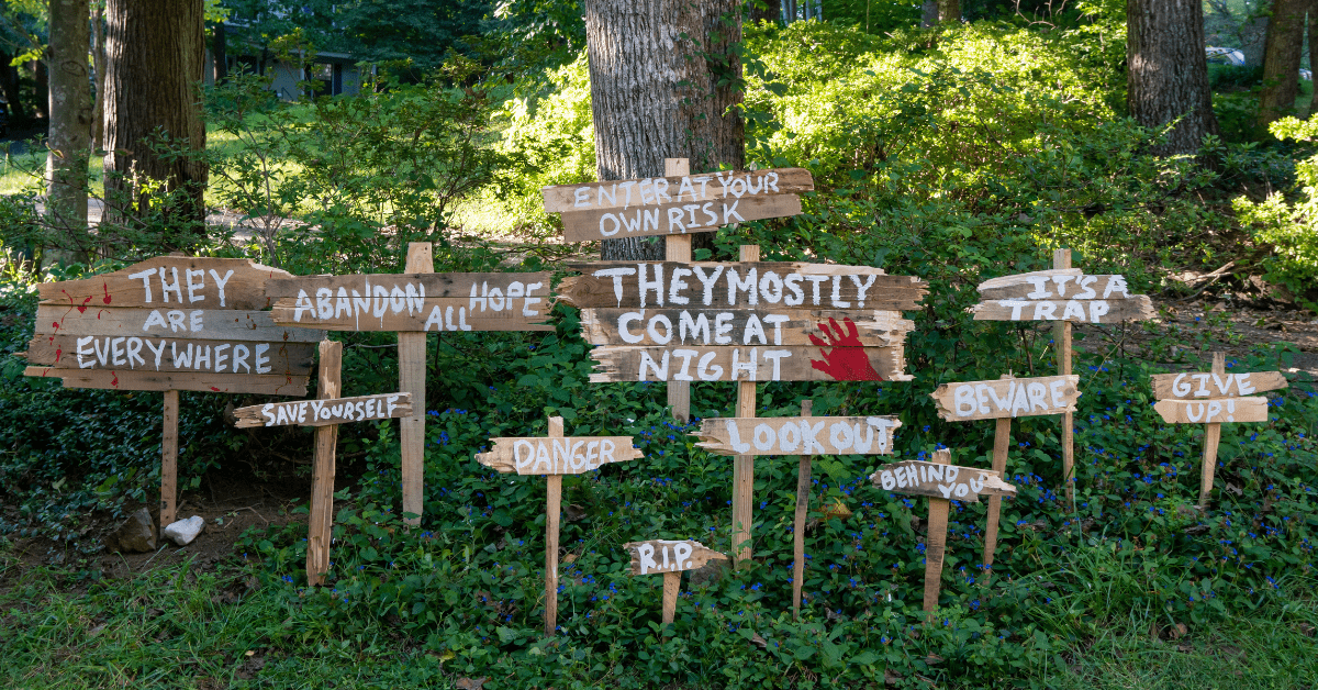 Scary signs as front yard decor.