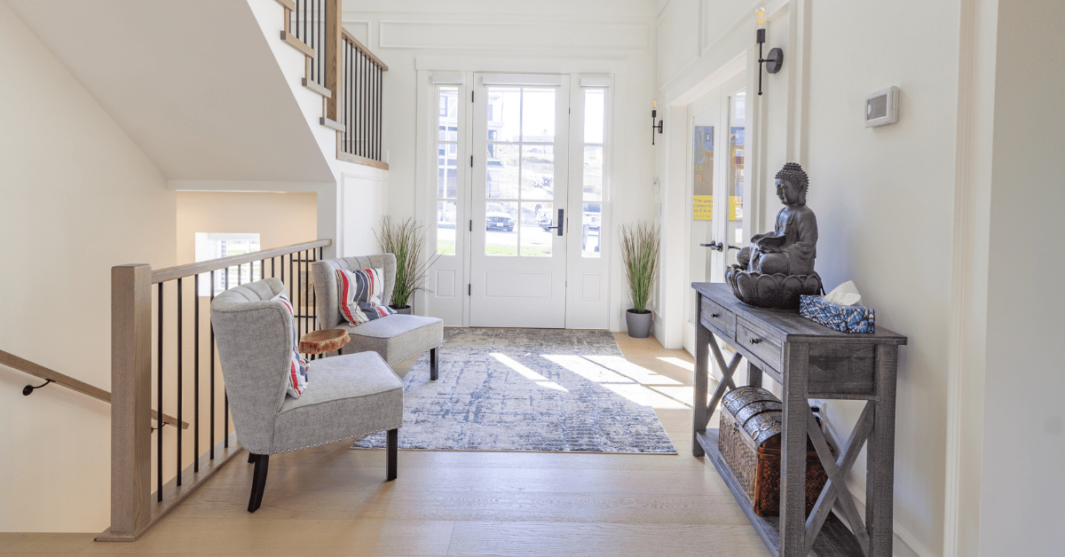 Spacious entryway with chair.