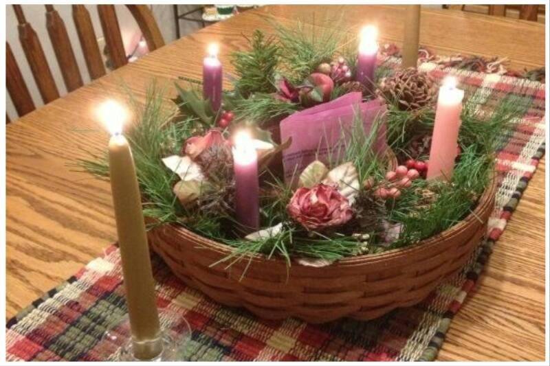 Lit up candles on table.