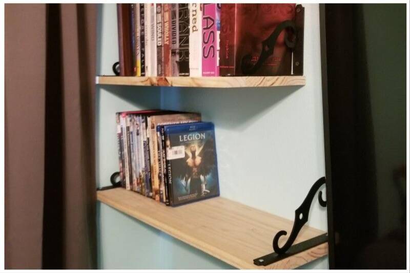 Floating shelves holding books.